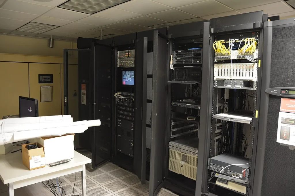 Rows of servers inside a large modern data centre facility.